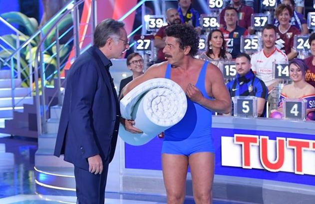 Ascolti TV | Venerdì 10 maggio 2019. Ciao Darwin (22.4%) batte ancora La Corrida (17.4%). L’Aquila – Grandi Speranze al 5.1% su Rai 3